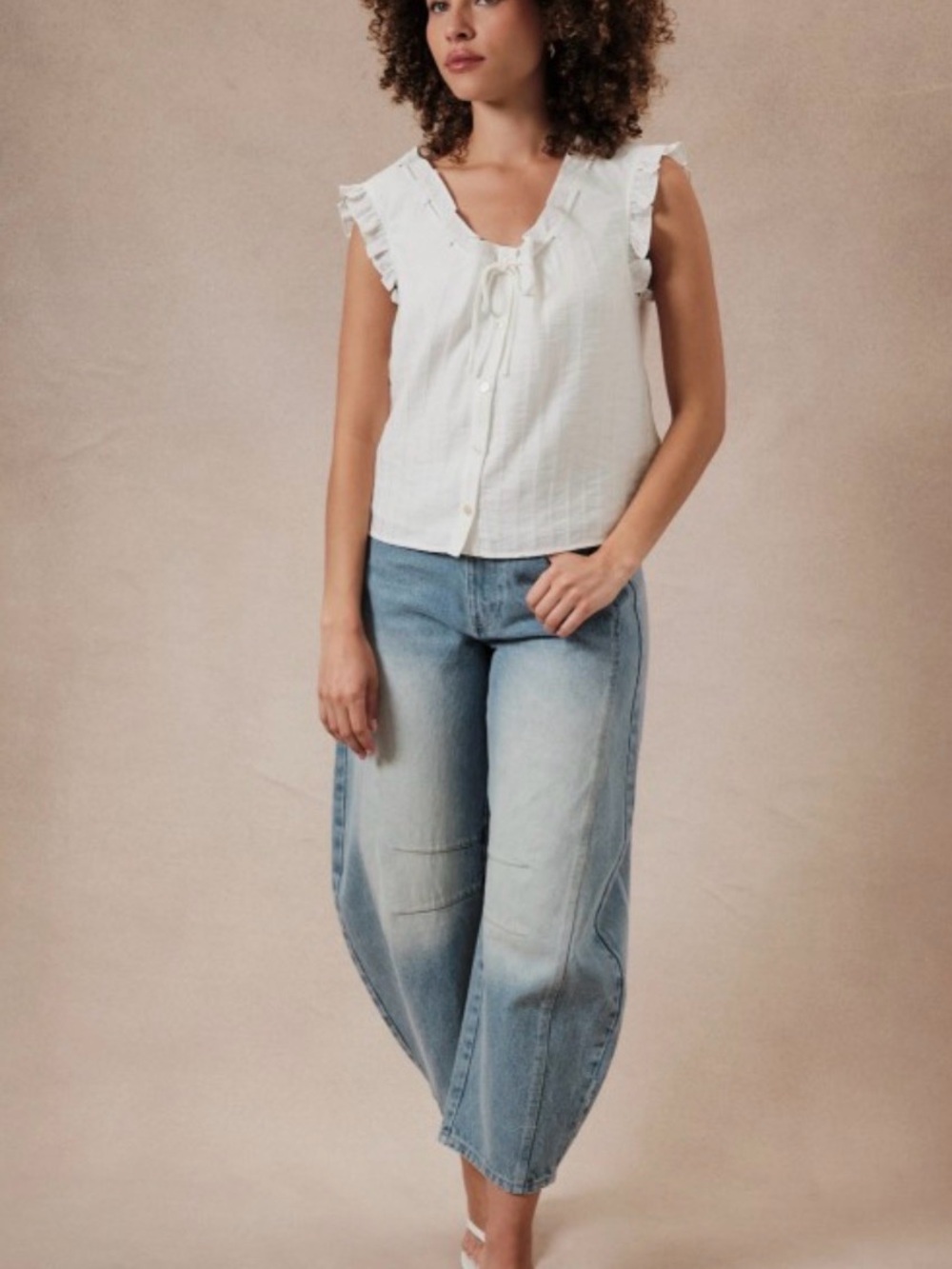 151. Women's White Ruffle Tie-Front Sleeveless Blouse